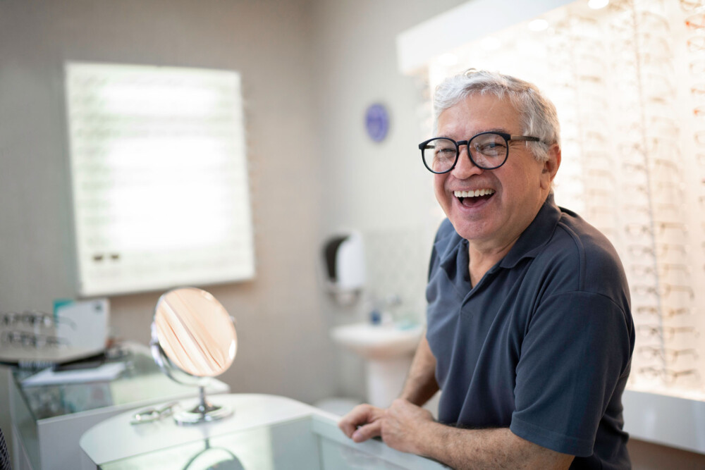 man in business casual shirt smiling